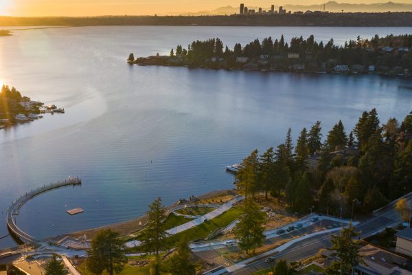USA, Washington State, Bellevue. Meydenbauer Park, Meydenbauer Bay, and Seattle skyline at sunset.